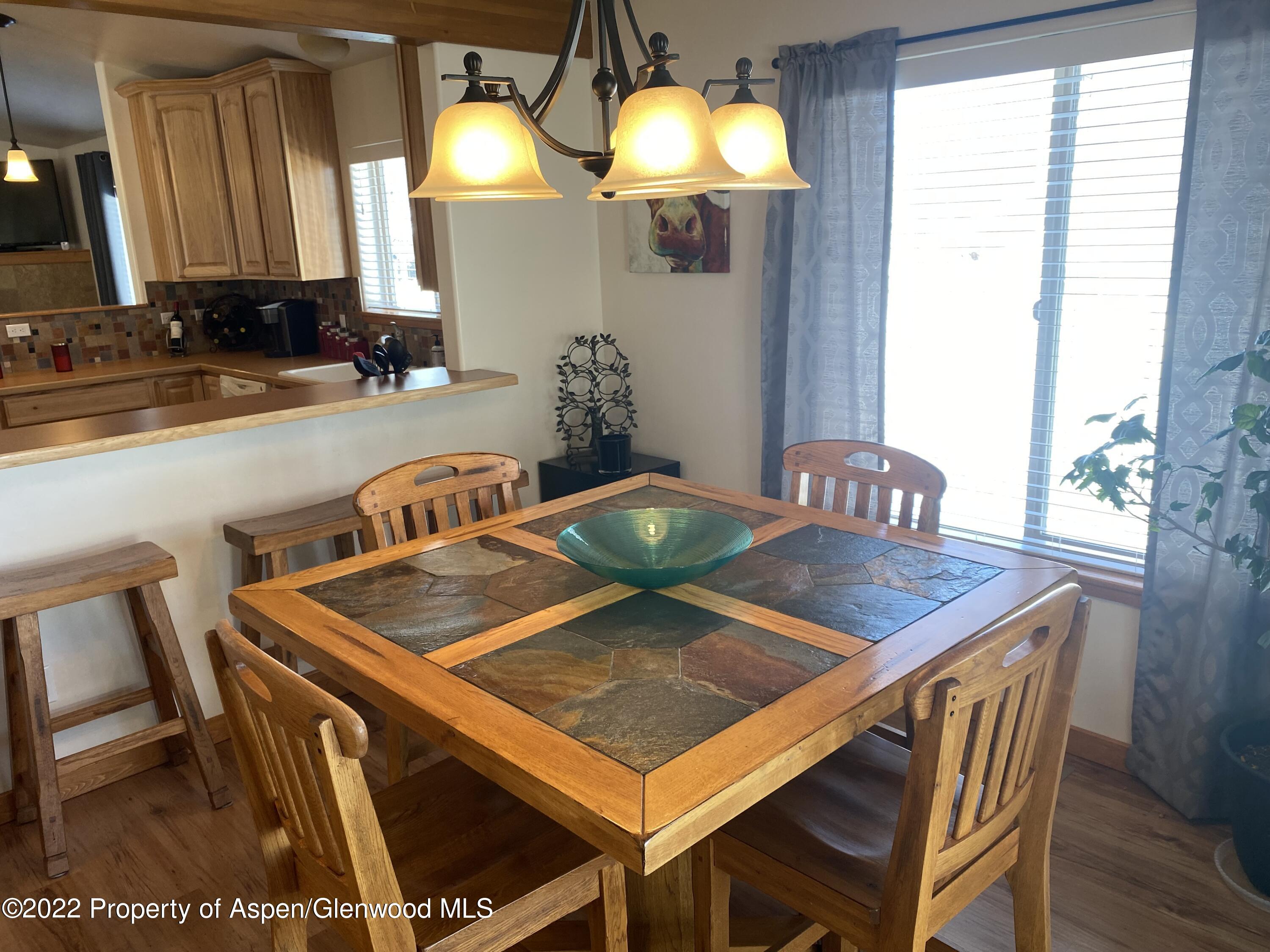 858 East 17th Street Rifle, CO 81650 - Photo 3 of 20 a view of a dining room with furniture and window