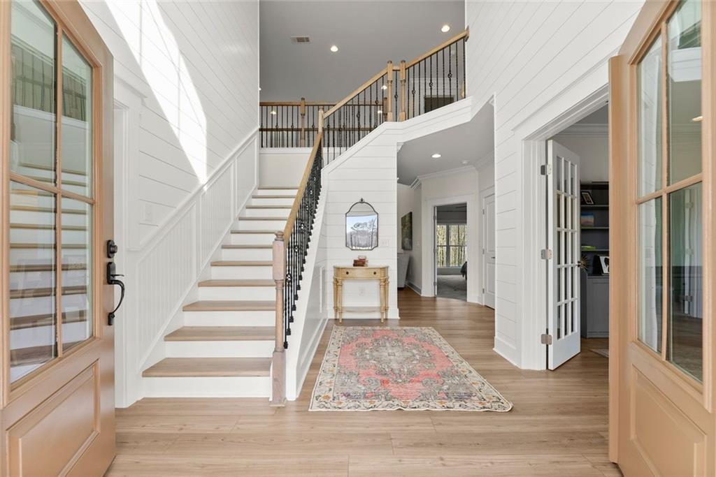 6998 Britt Gailey Road Clermont, GA 30527 - Photo 6 of 92 a view of entryway and hall with wooden floor