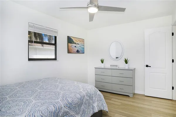 a bedroom with a bed and a dresser
