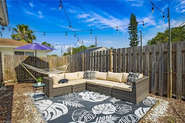 a building outdoor space with patio couches and potted plants