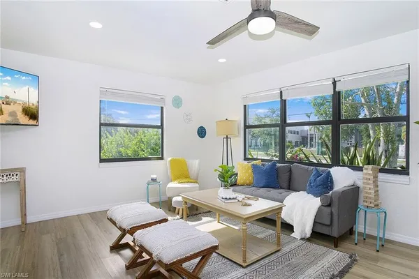 a living room with furniture and a window