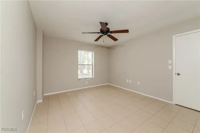 a view of room with window and ceiling fan