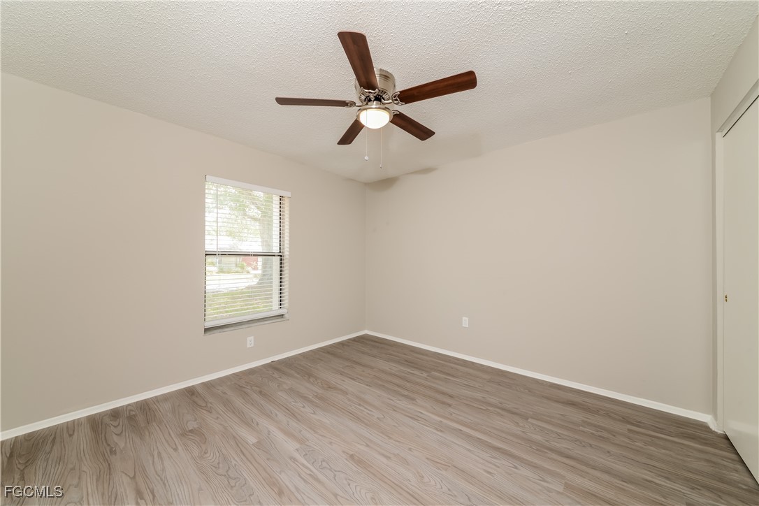 3286 Papaya Road Venice, FL 34293 - Photo 12 of 16 wooden floor in an empty room with a window