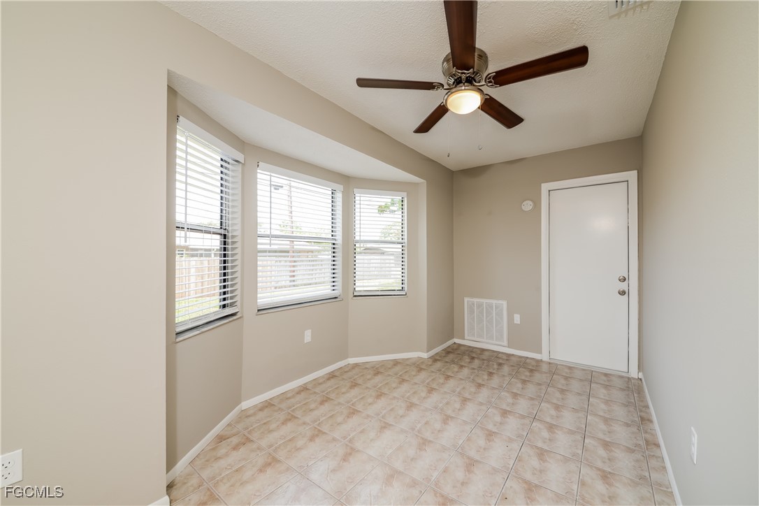 3286 Papaya Road Venice, FL 34293 - Photo 4 of 16 a view of empty room with wooden floor and fan