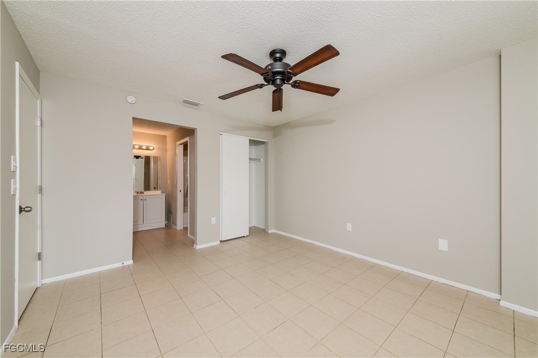 3286 Papaya Road Venice, FL 34293 - Photo 8 of 16 a view of a livingroom with a ceiling fan & window
