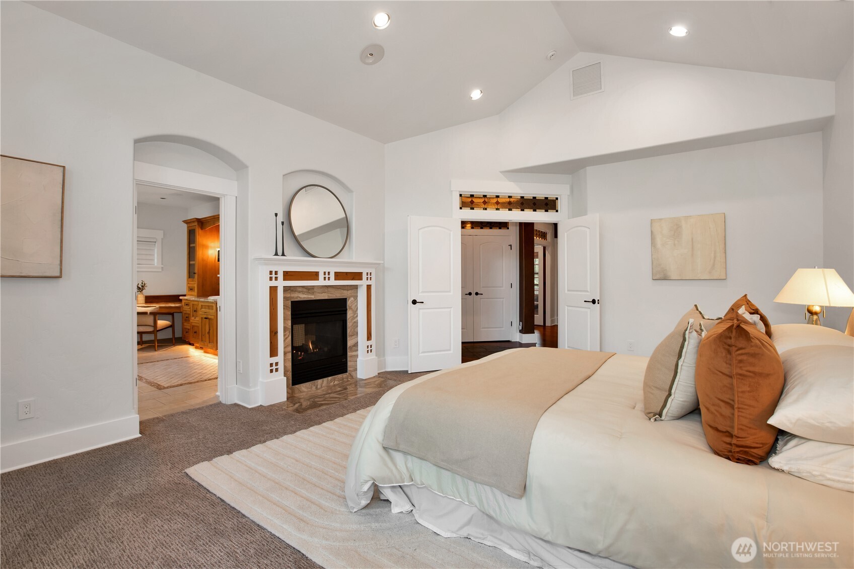 7732 Rich Road Southeast Olympia, WA 98501 - Photo 14 of 40 a bedroom with a bed and a fireplace