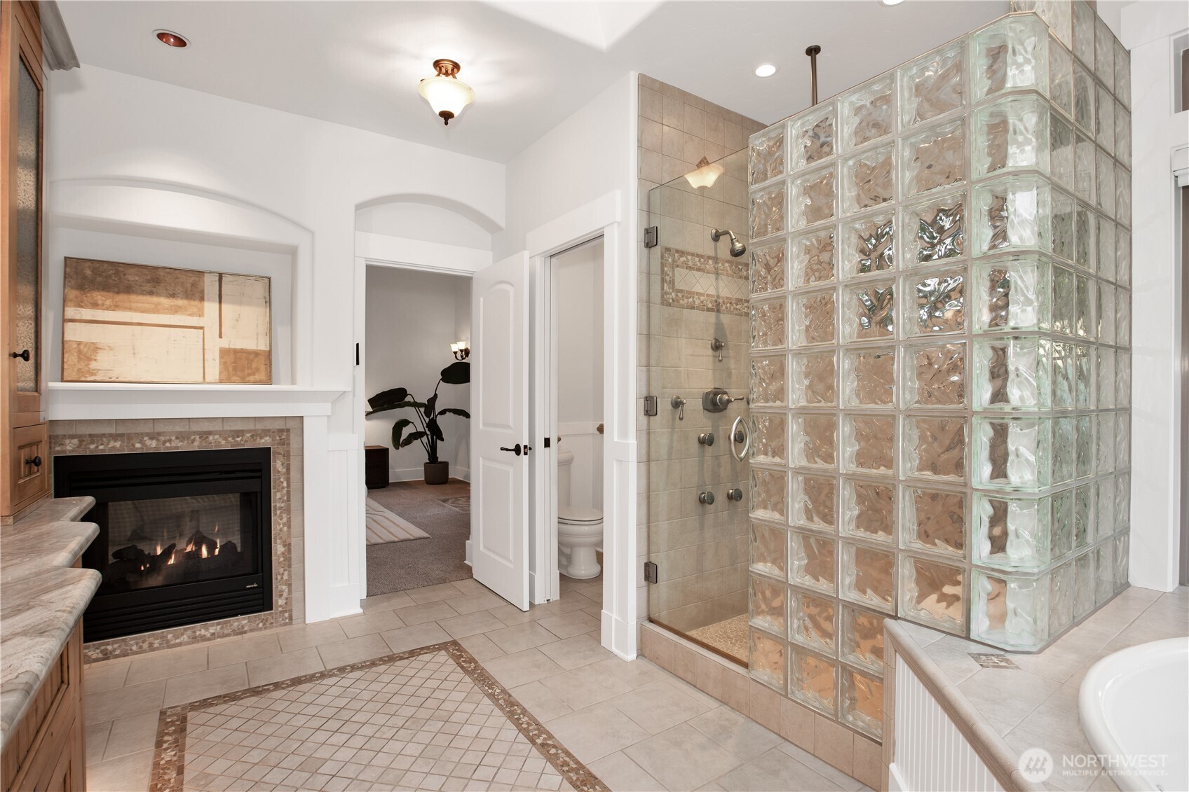 7732 Rich Road Southeast Olympia, WA 98501 - Photo 17 of 40 a living room with a fireplace and a shower
