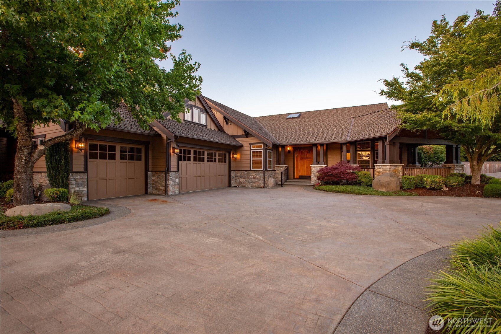 7732 Rich Road Southeast Olympia, WA 98501 - Photo 2 of 40 a front view of a house with a yard and garage