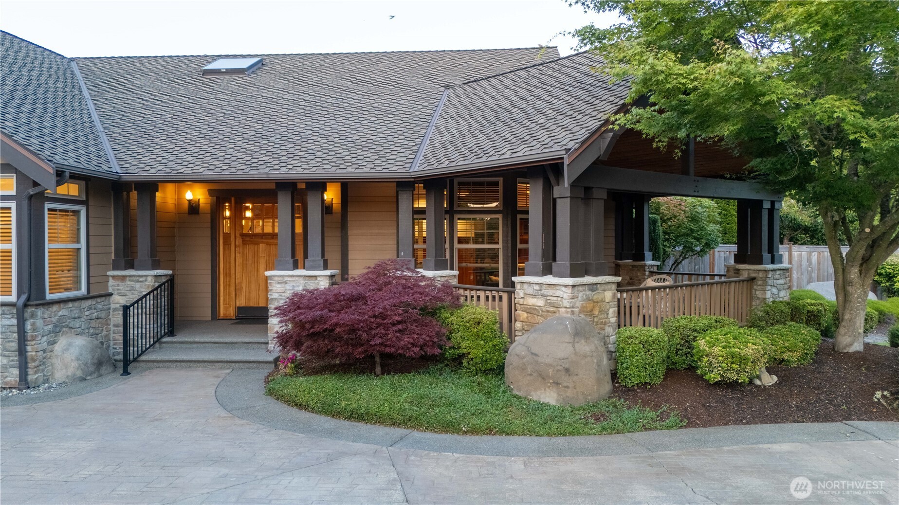 7732 Rich Road Southeast Olympia, WA 98501 - Photo 3 of 40 a view of a house with potted plants and a large tree