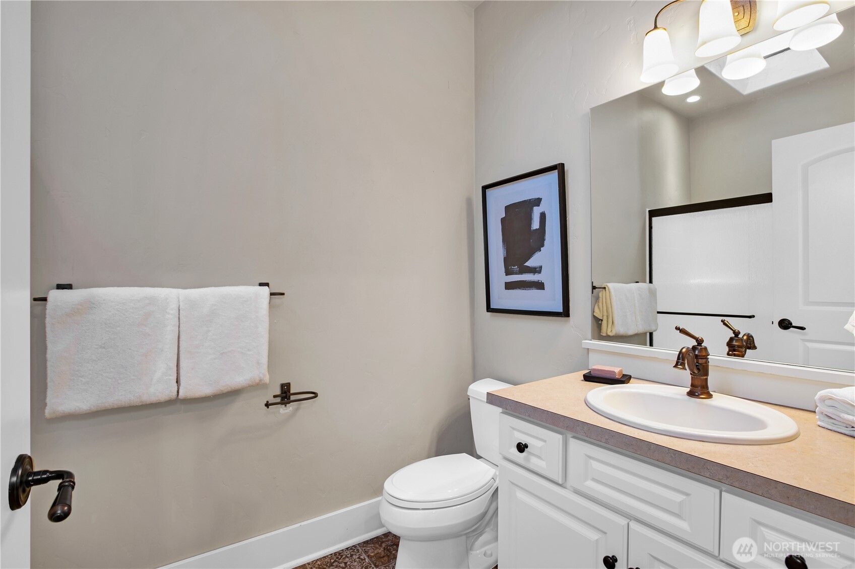 7732 Rich Road Southeast Olympia, WA 98501 - Photo 35 of 40 a bathroom with a granite countertop sink a toilet and a mirror