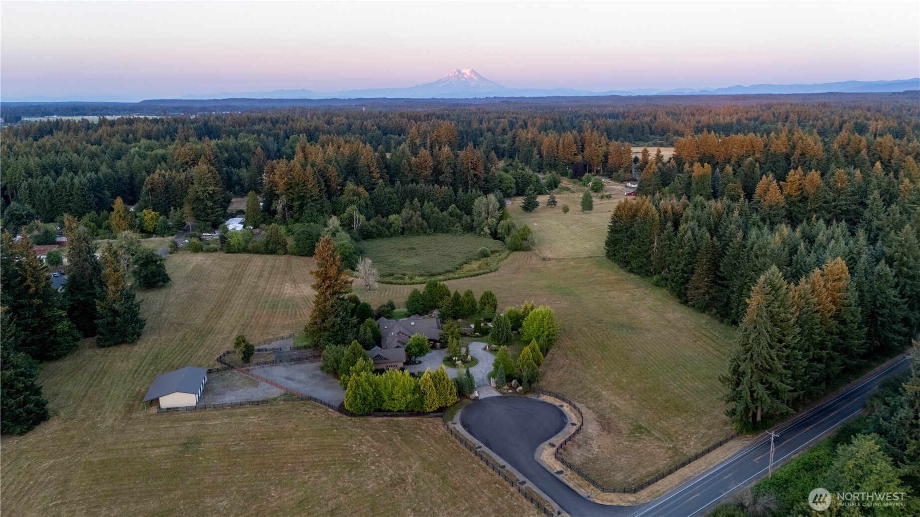 7732 Rich Road Southeast Olympia, WA 98501 - Photo 36 of 40 an aerial view of a house with a yard and lake view