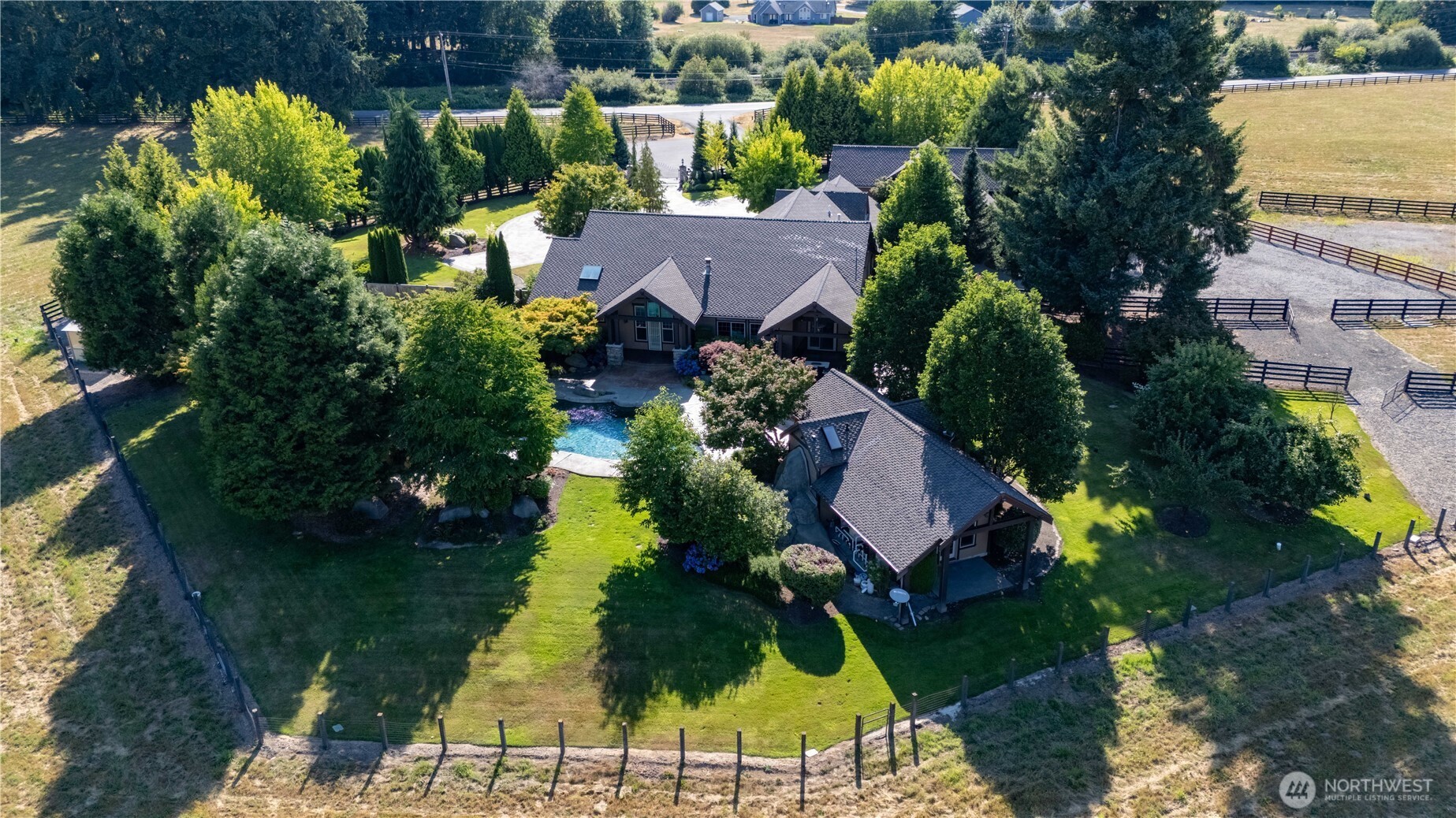 7732 Rich Road Southeast Olympia, WA 98501 - Photo 37 of 40 an aerial view of a house with garden space and lake view