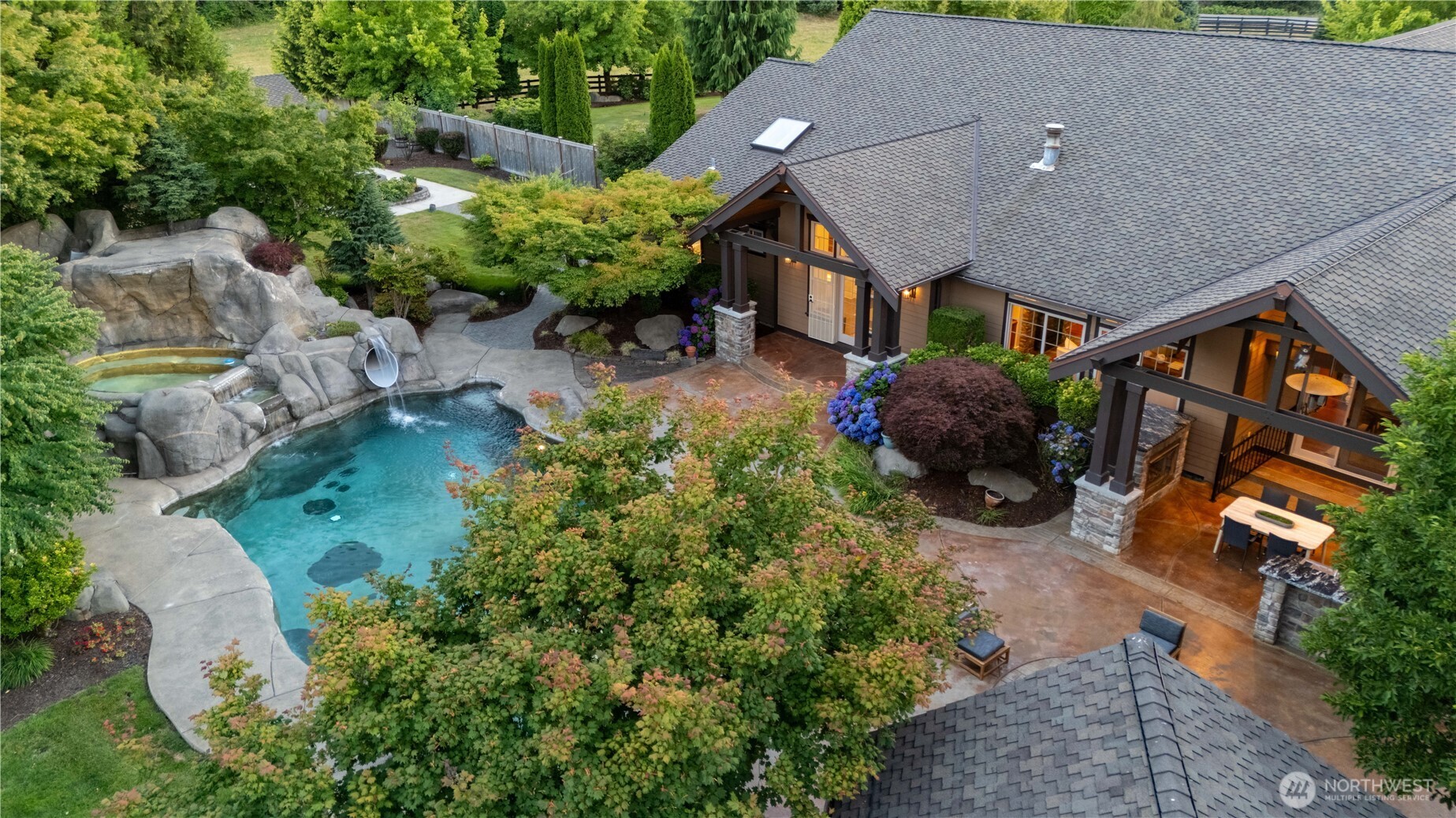 7732 Rich Road Southeast Olympia, WA 98501 - Photo 4 of 40 an aerial view of a house with a yard and garden