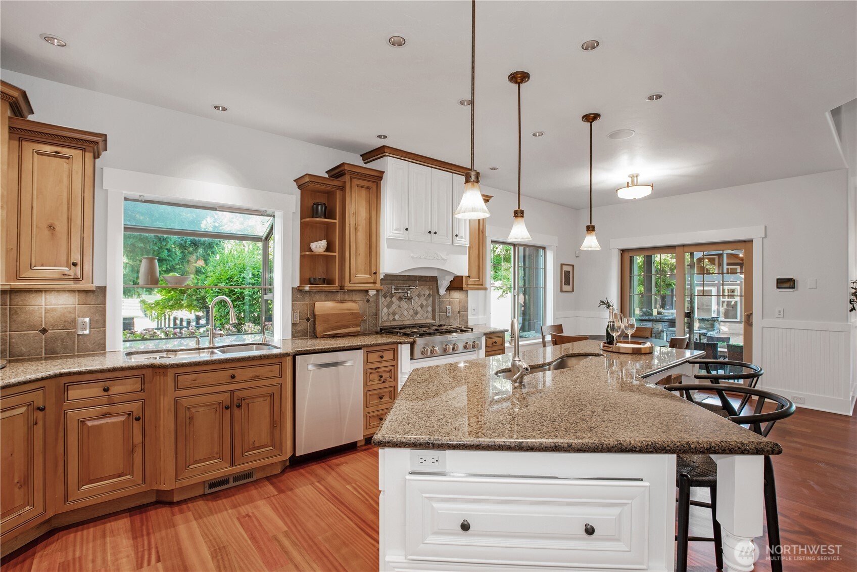 7732 Rich Road Southeast Olympia, WA 98501 - Photo 7 of 40 a kitchen with sink stove and cabinets