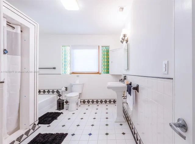 a bathroom with a bathtub and a sink