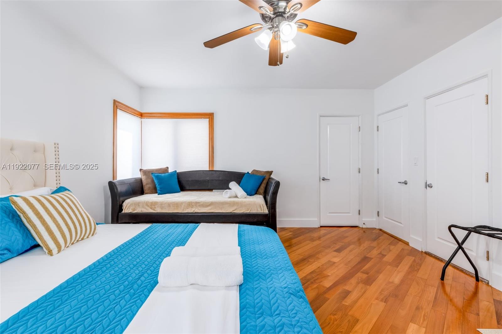 1230 Southwest 22nd Terrace Miami, FL 33145 - Photo 33 of 35 a bedroom with a bed and wooden floor