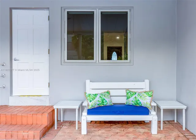 a view of an entryway with front door