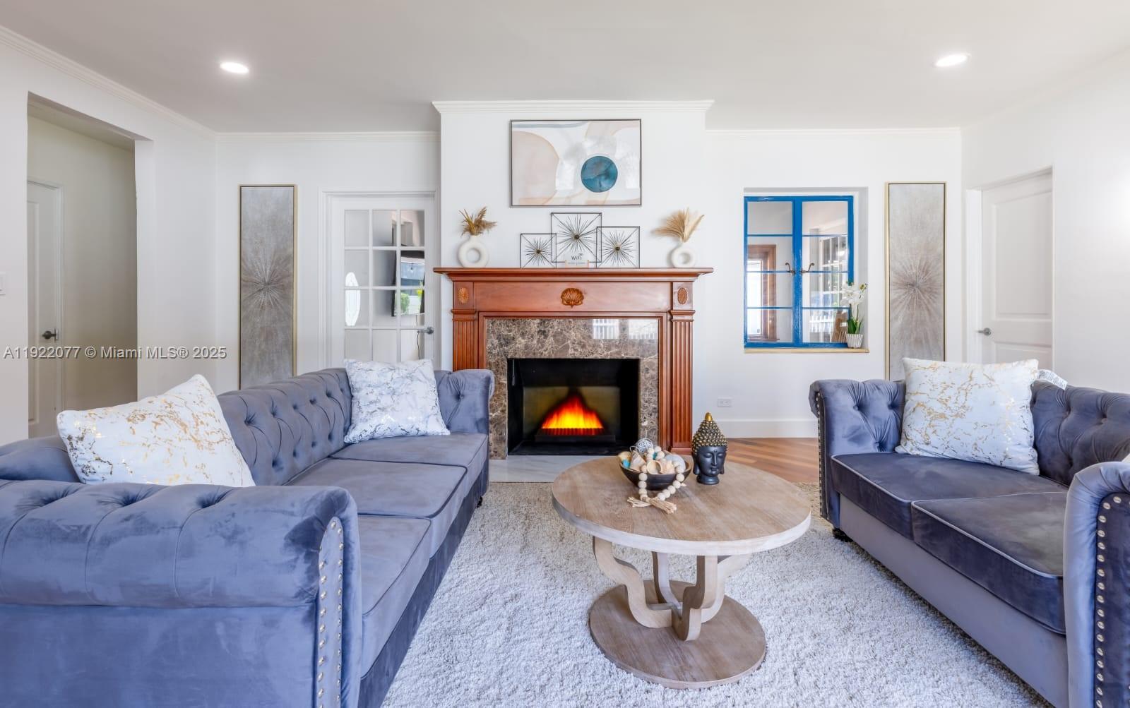 1230 Southwest 22nd Terrace Miami, FL 33145 - Photo 4 of 35 a living room with furniture and a fireplace