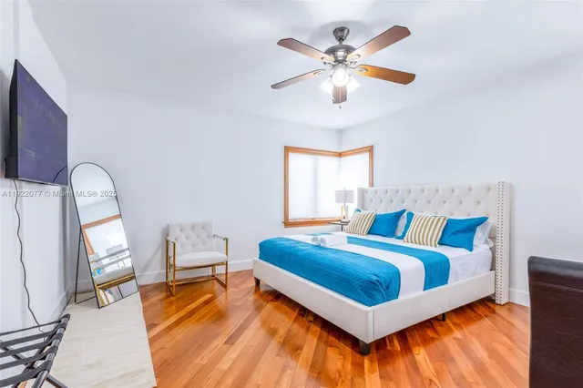 a bedroom with bed and a window