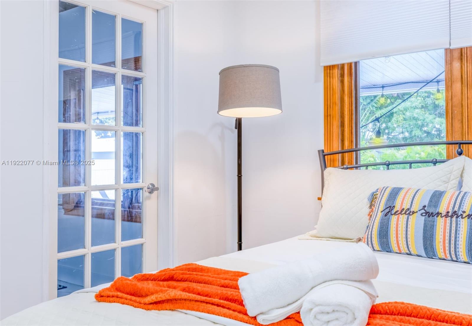 1230 Southwest 22nd Terrace Miami, FL 33145 - Photo 8 of 35 a bedroom with a bed and a lamp on dresser