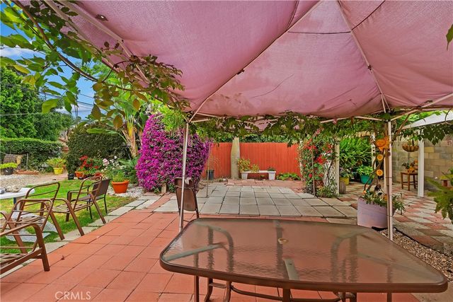 a patio with table and chairs