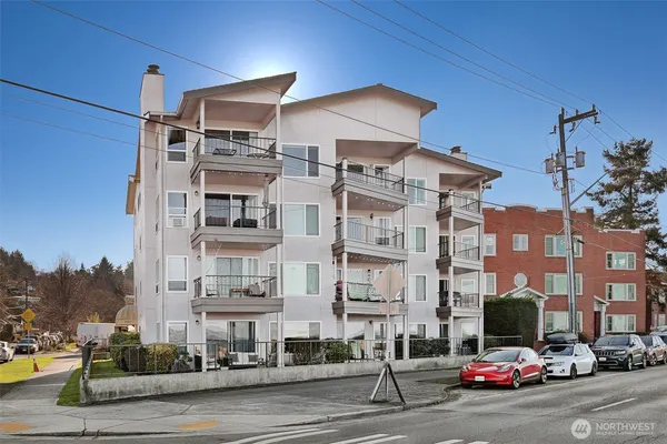 a city street lined with buildings and cars