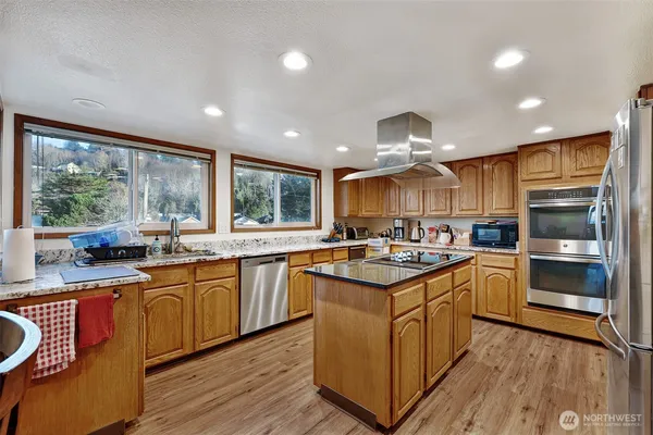 a kitchen with lots of counter top space and appliances