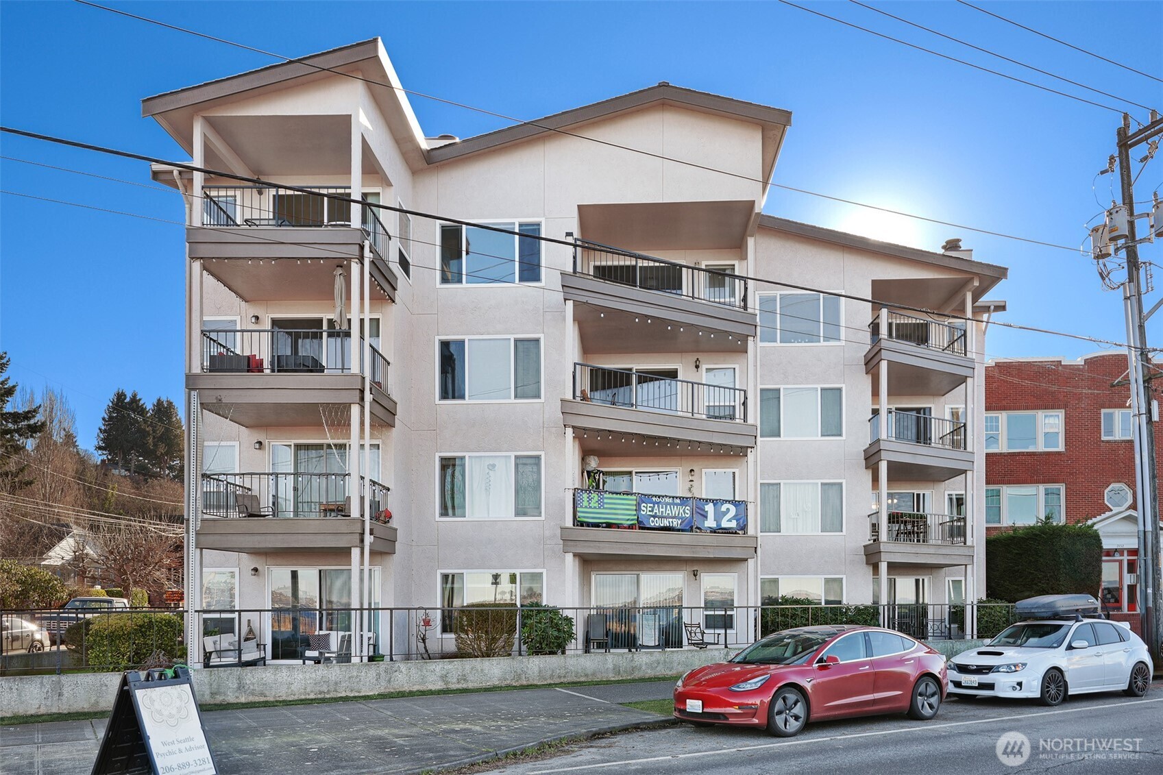 2440 Alki Avenue Southwest Seattle, WA 98116 - Photo 2 of 27 a car parked in front of a building