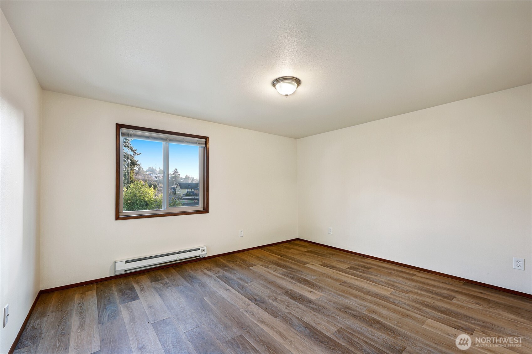 2440 Alki Avenue Southwest Seattle, WA 98116 - Photo 10 of 27 a view of a room with wooden floor and window