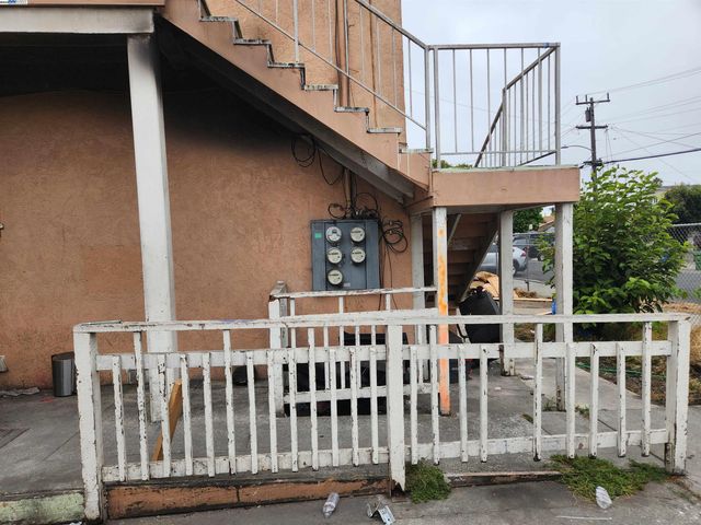 a view of a balcony with staircase