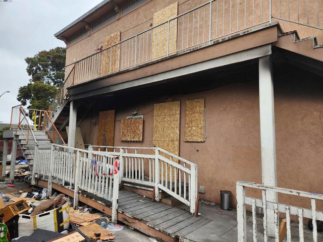 a view of a house with iron fence