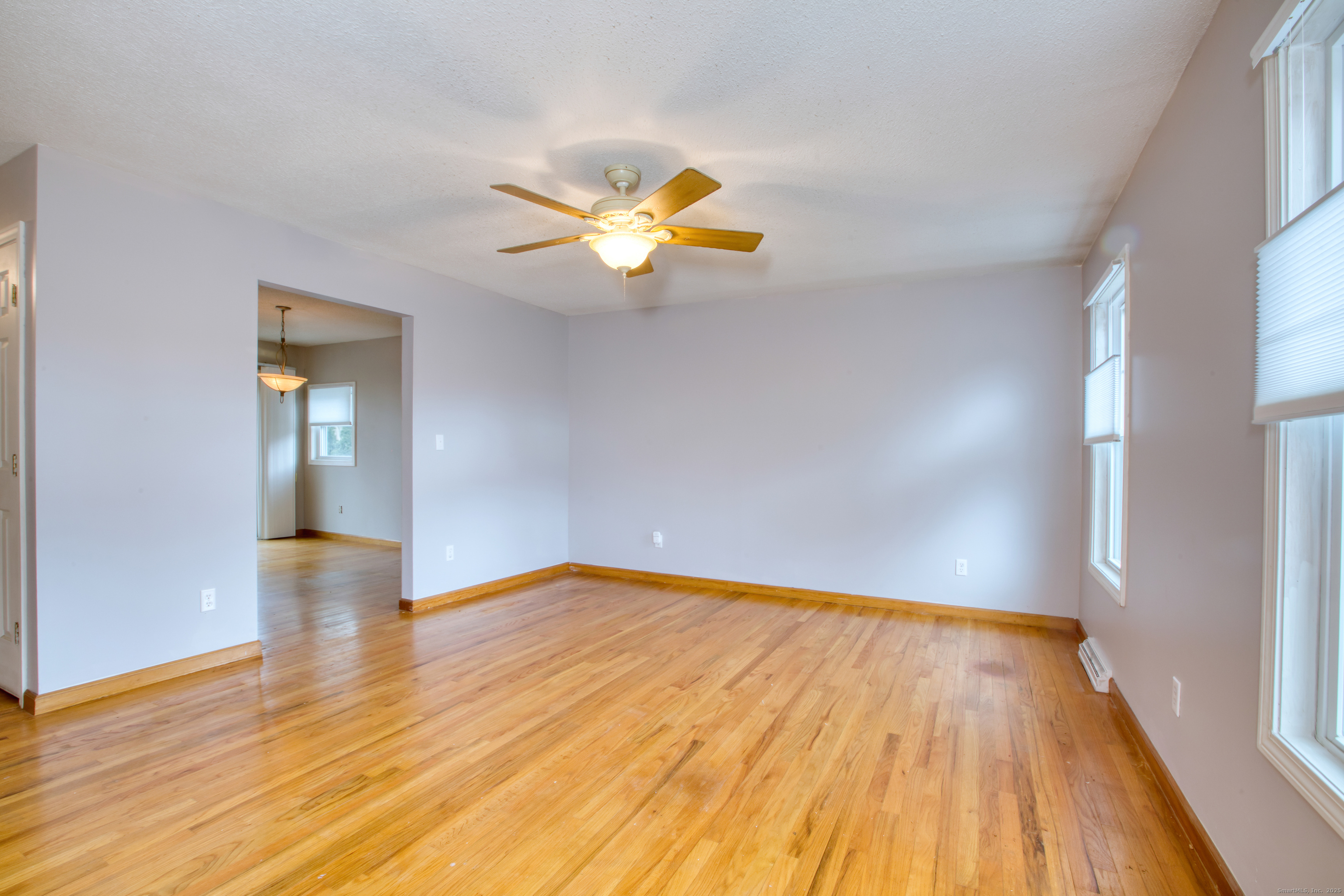 12 Clancy Road, Unit A Branford, CT 06405 - Photo 11 of 31 a view of empty room with wooden floor and fan