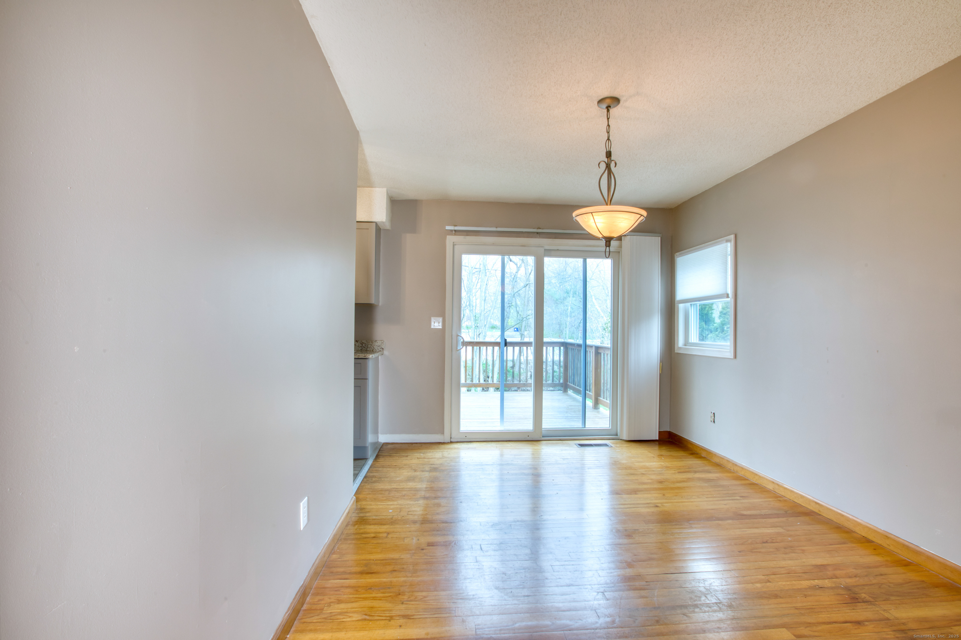 12 Clancy Road, Unit A Branford, CT 06405 - Photo 14 of 31 a view of an room with wooden floor and windows