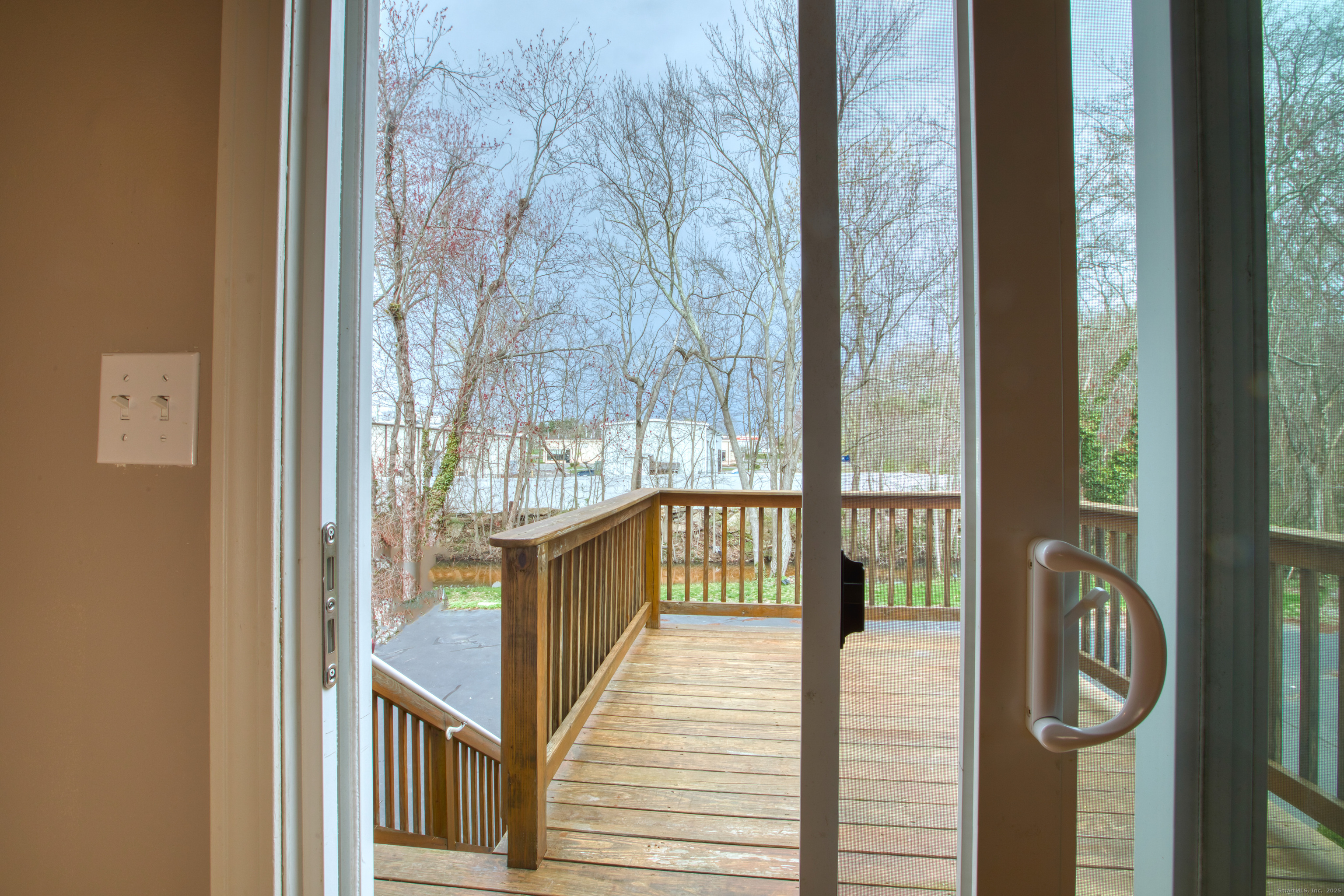 12 Clancy Road, Unit A Branford, CT 06405 - Photo 16 of 31 a view of a balcony with wooden floor