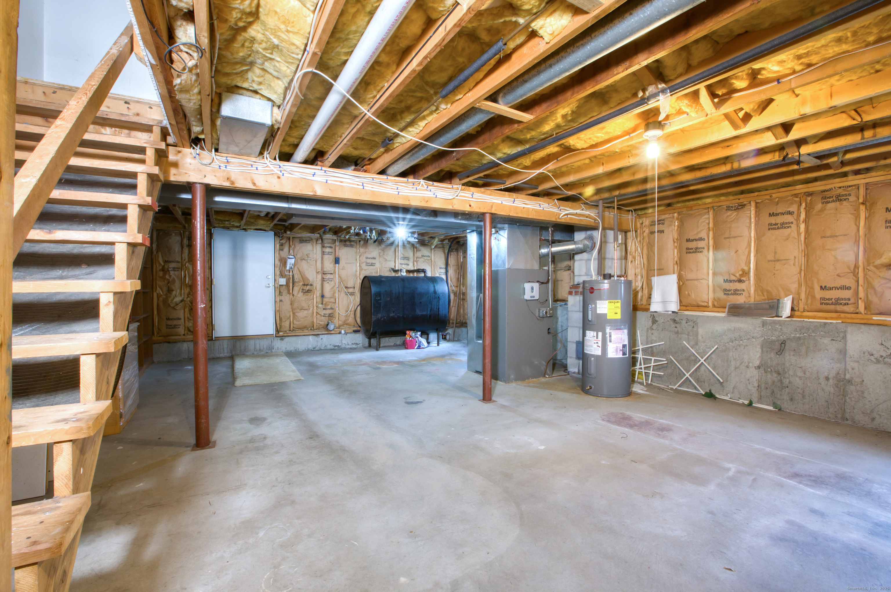 12 Clancy Road, Unit A Branford, CT 06405 - Photo 24 of 31 a view of an empty room with wooden floor and a sink