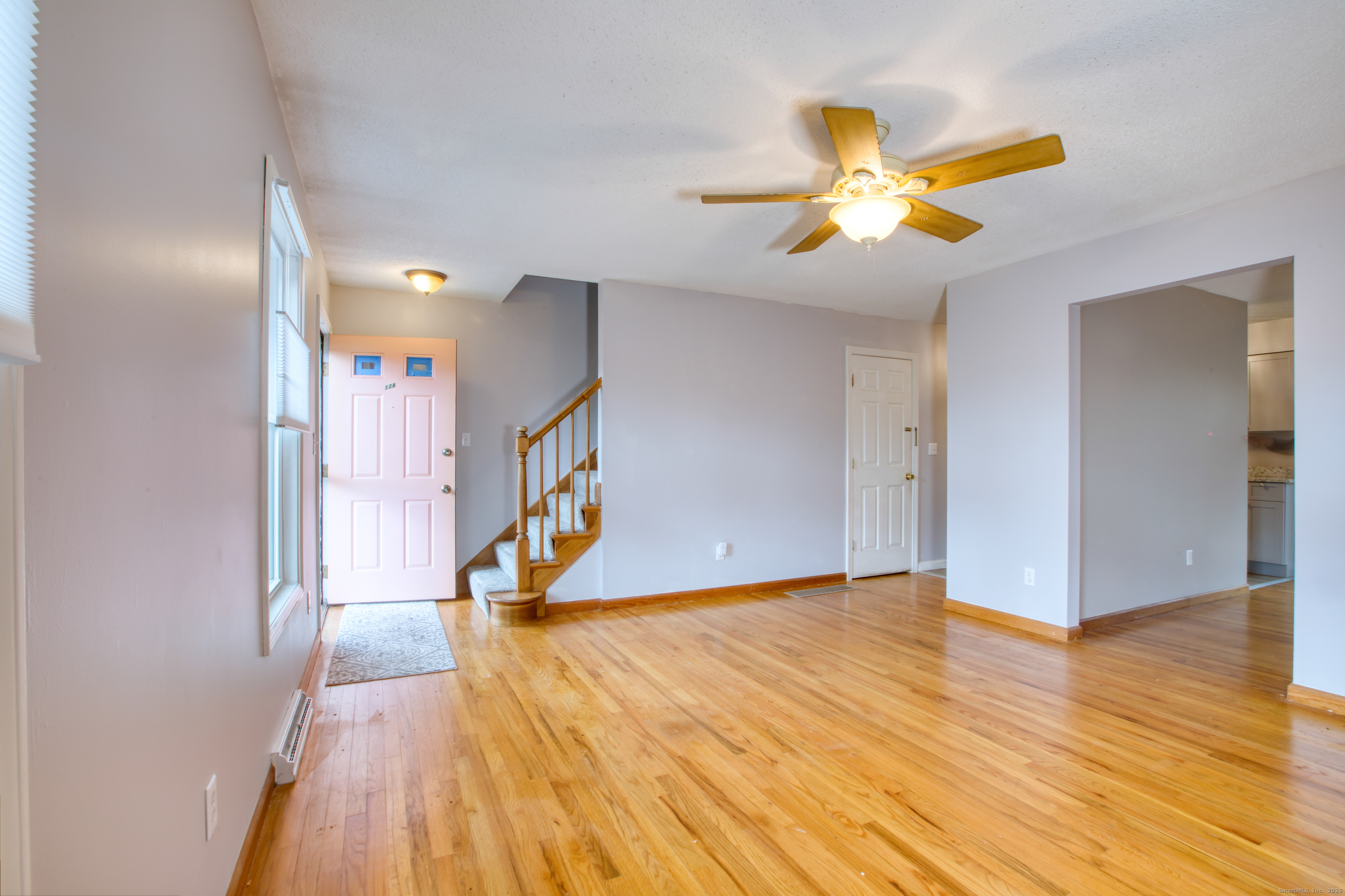 12 Clancy Road, Unit A Branford, CT 06405 - Photo 10 of 31 a view of an empty room with wooden floor