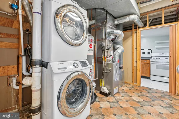 a view of a storage & utility room with a washer dryer