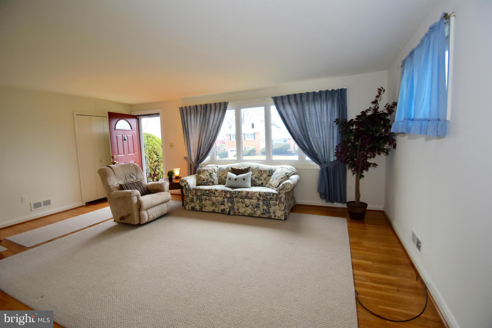 215 Rollingfield Road Catonsville, MD 21228 - Photo 5 of 22 Exposed HW floors picture window