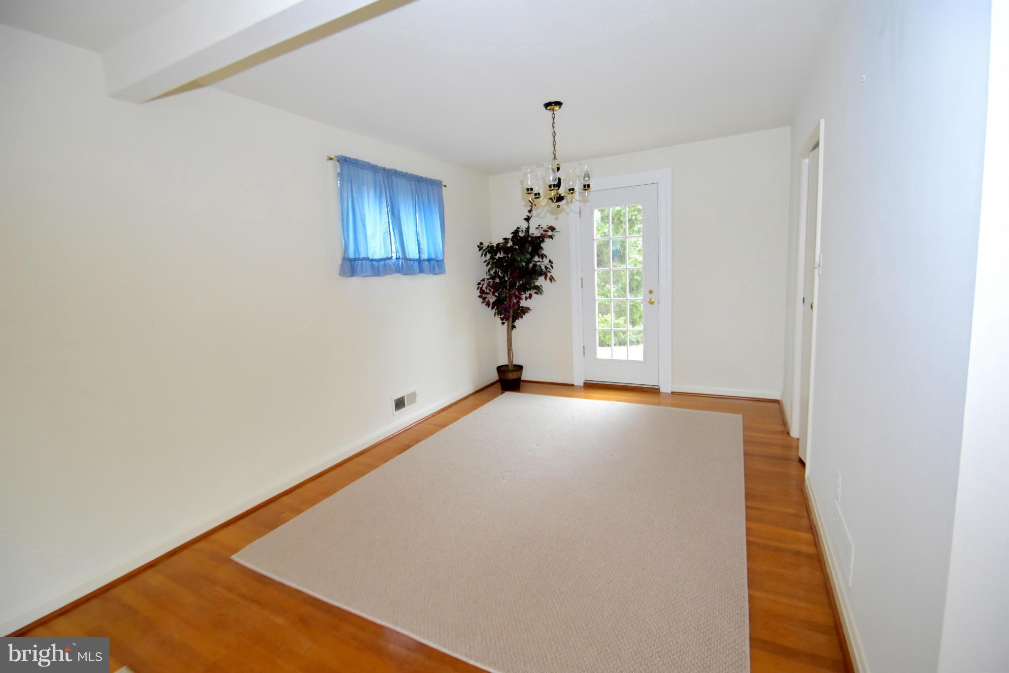 215 Rollingfield Road Catonsville, MD 21228 - Photo 7 of 22 Exposed HW with access to large patio
