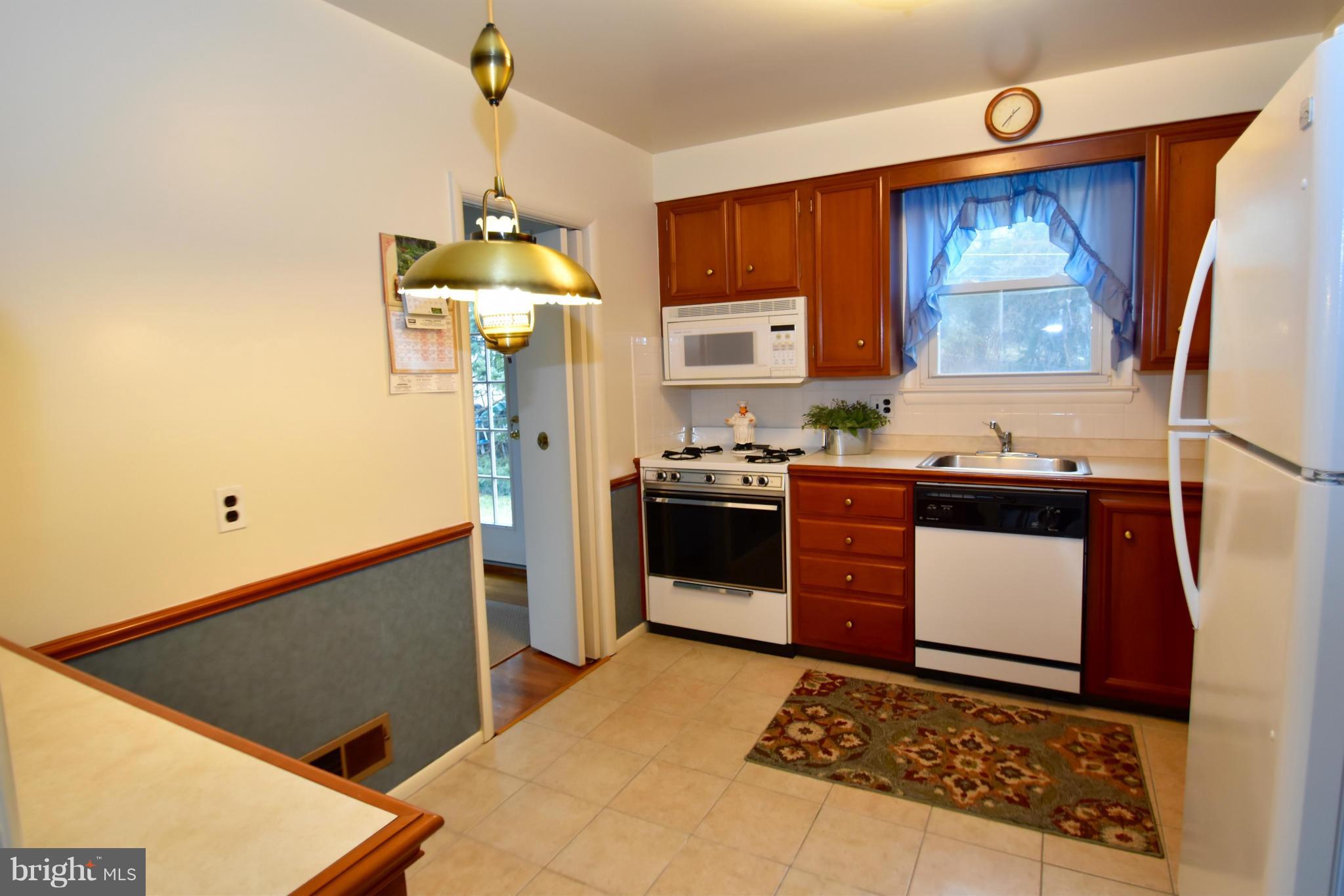 215 Rollingfield Road Catonsville, MD 21228 - Photo 9 of 22 Ceramic tile floor w/solid wood cabinets