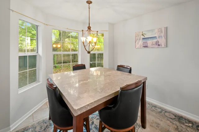 a view of a dining room with furniture window and outside view