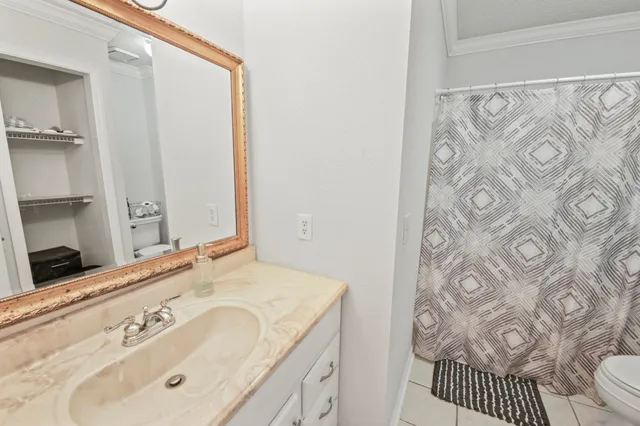 a en suite bathroom with a sink and a mirror