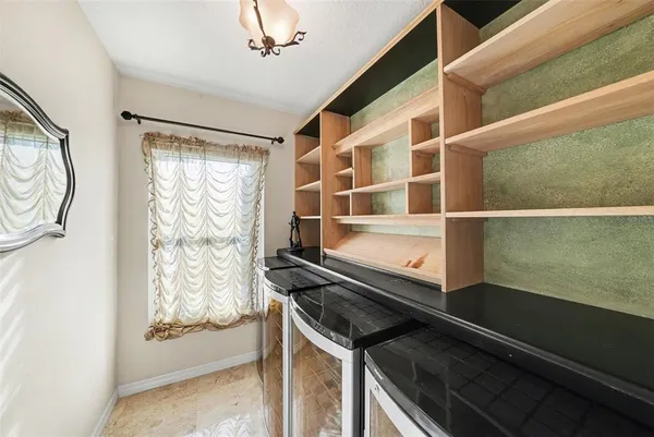 a view of an empty room and window