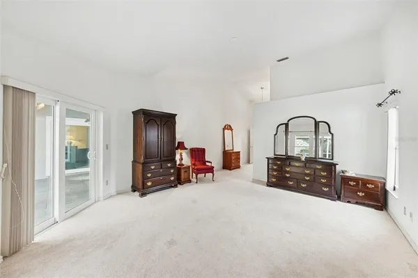 a bed room with furniture and a flat screen tv