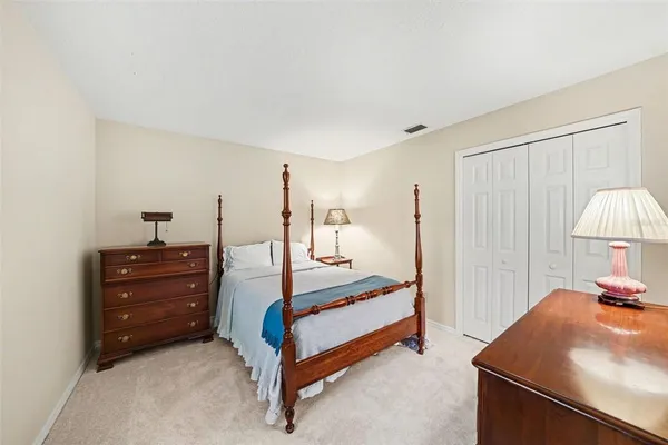 a bedroom with a bed and a dresser