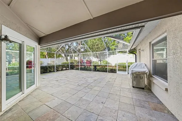 a lobby with furniture and floor to ceiling window