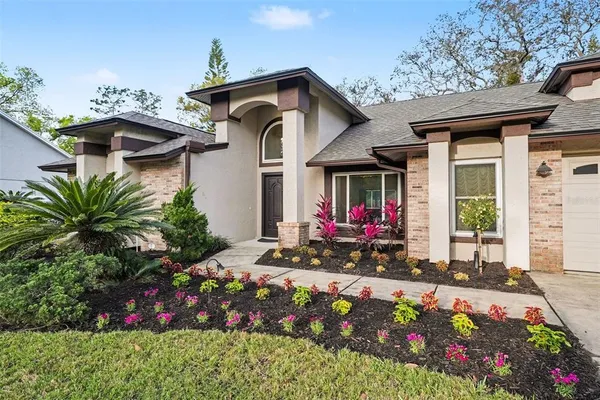 a front view of a house with yard