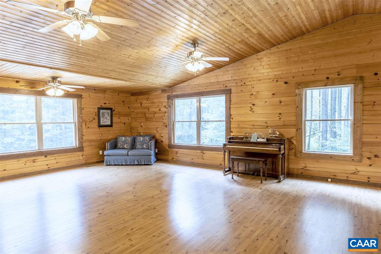 703 George James Loop Radiant, VA 22732 - Photo 13 of 48 a view of a livingroom with furniture a fireplace and wooden floor