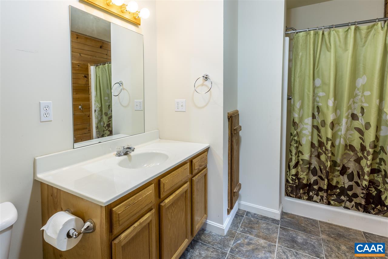 703 George James Loop Radiant, VA 22732 - Photo 26 of 48 a bathroom with a sink and a mirror