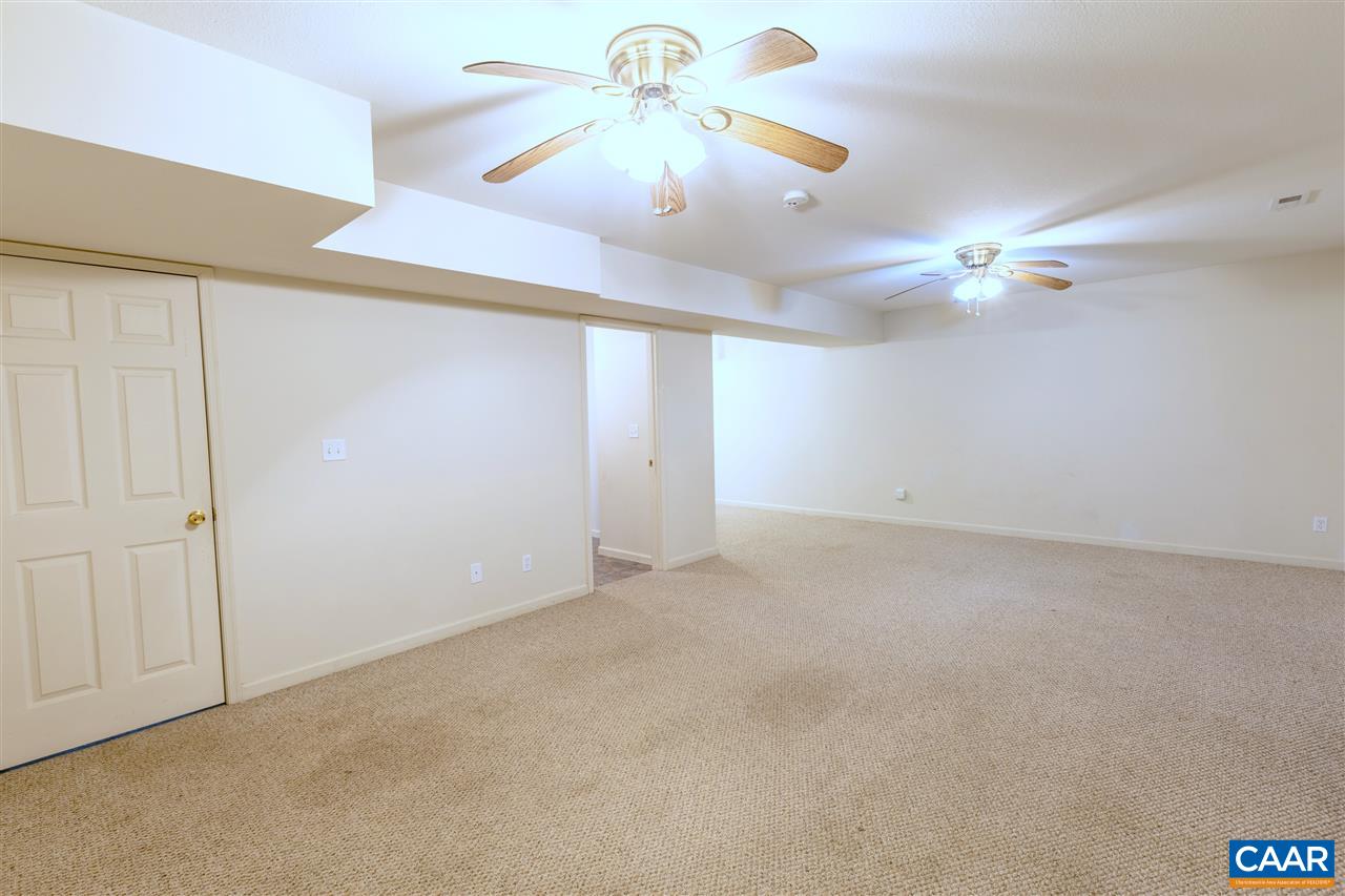 703 George James Loop Radiant, VA 22732 - Photo 29 of 48 an empty room with chandelier fan and windows